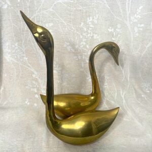 Large vintage brass swans
